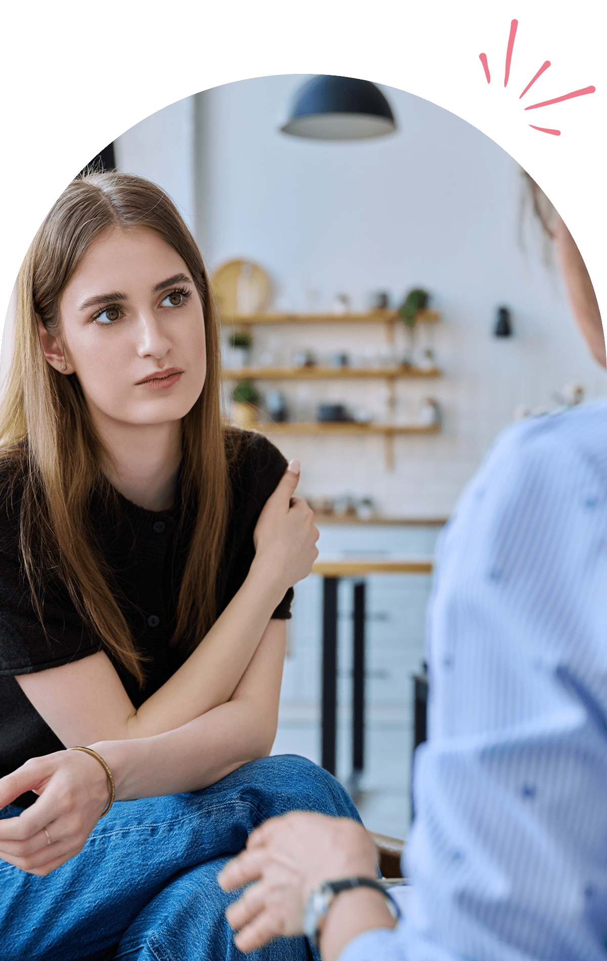 7 A woman listens attentively during a conversation.